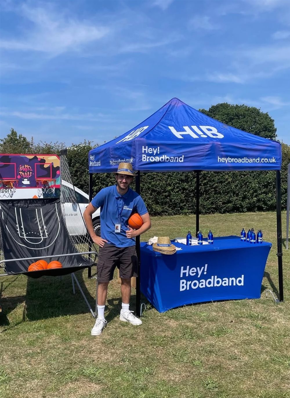 An Outsourc3d brand ambassador working at a branded event stand